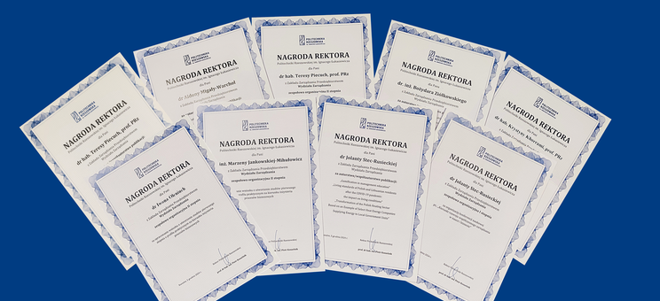 Zdjęcie dyplomów nagród dla pracowników ZZP - 9 dyplomów ułożonych w wachlarz. 